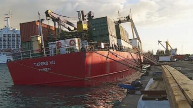 eBlue_economy_Cargo ship rested on bottom at Papeete Port, French Polynesia